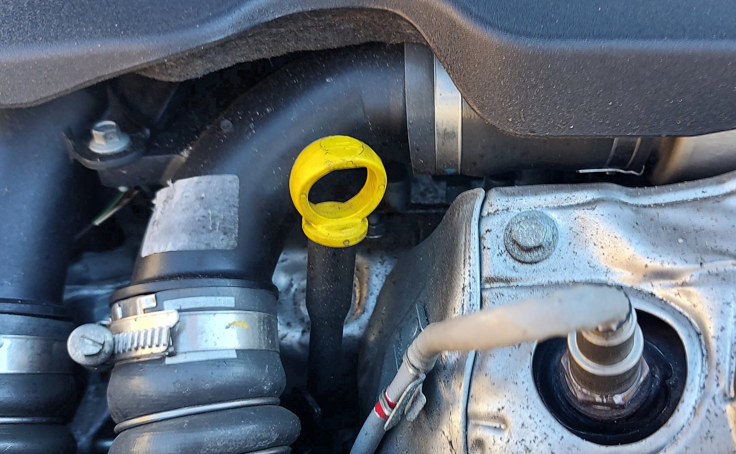 Yellow engine oil dipstick handle